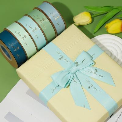 Ribbon Satin Polyeater Cetak Folium Emas yang Disesuaikan untuk Kemasan Hadiah